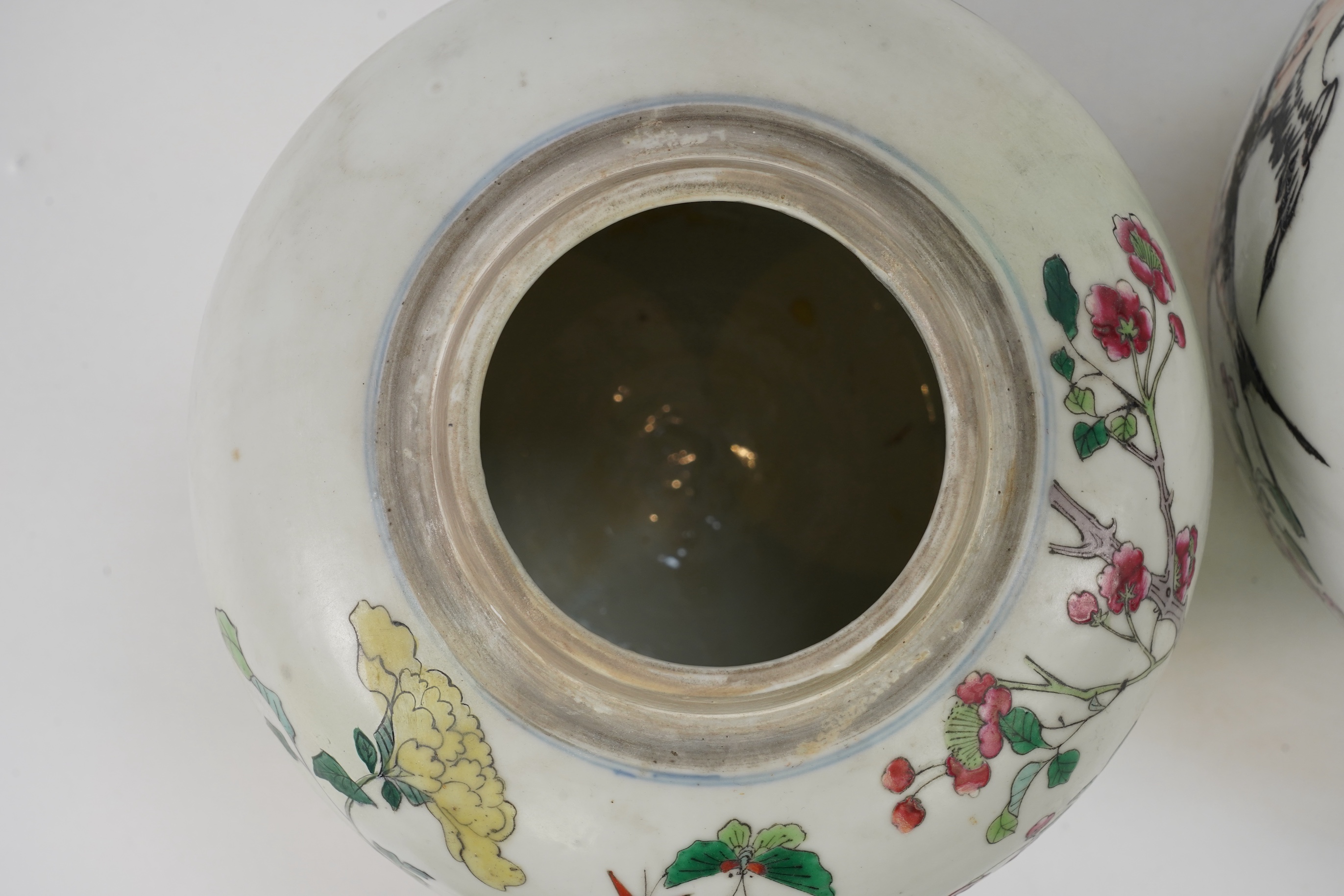 A pair of Chinese famille rose jars and covers, Kangxi mark but late 19th/early 20th century